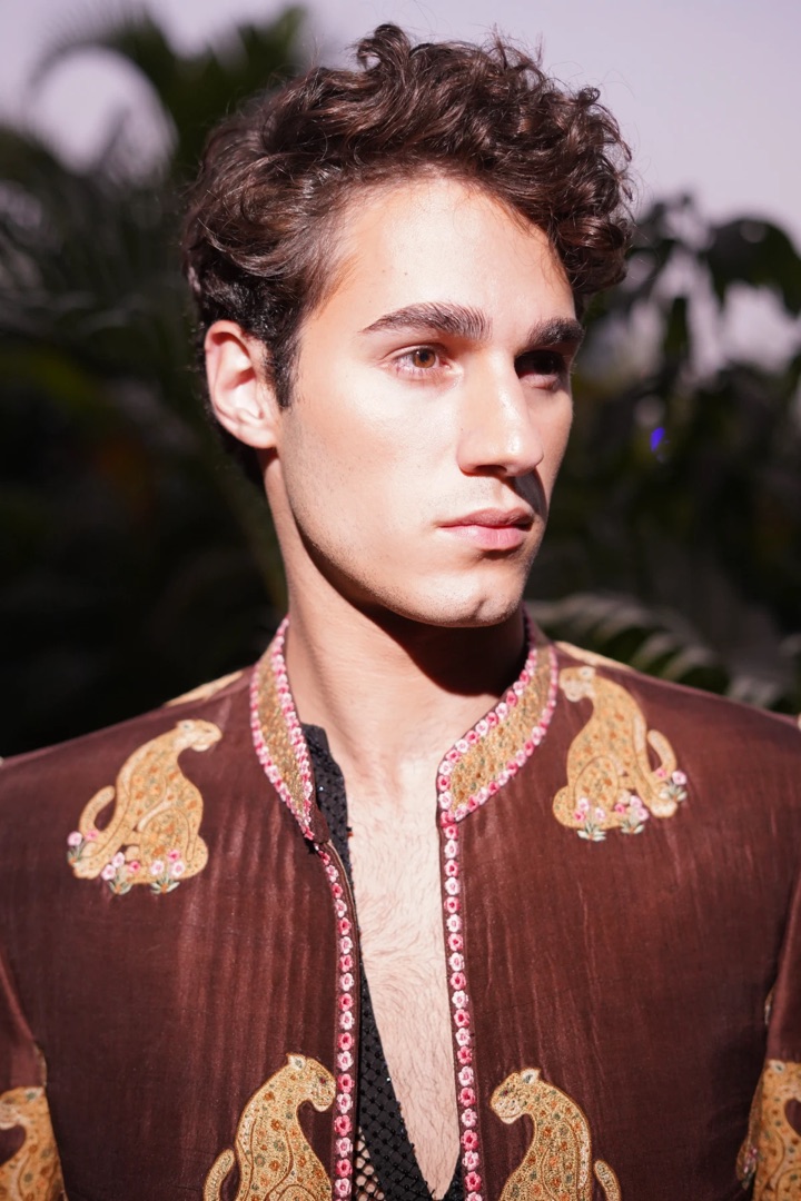 Zardozi butas — gold wire paisleys raised on brown silk, in close view